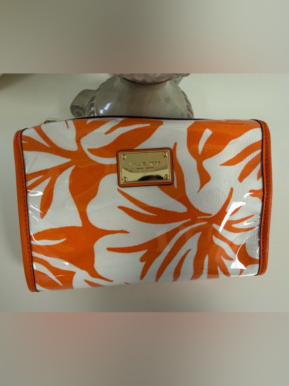 Michael Kors Orange and White Floral Cosmetic Pouch with Gold Plaque